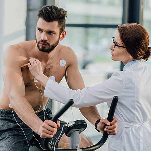 Bachelor of Sport and Exercise Science graduate conducting a fitness test on an athlete