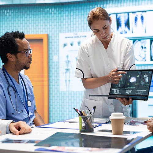 Doctors reviewing digital health data – MSc Health Technology abroad.