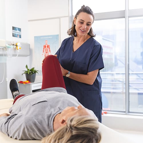 Student practicing physiotherapy techniques on a patient during training – study physiotherapy abroad in UK