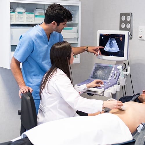 Healthcare professionals performing a scan during MSc Medical Ultrasound UK training session