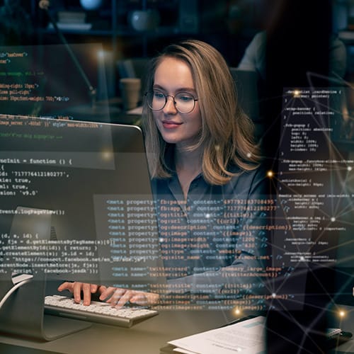 Student coding on computer while studying Bachelor of Information Technology in Australia