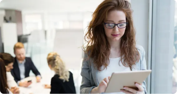 Female student using a tablet while pursuing a Graduate Certificate in Health Science.